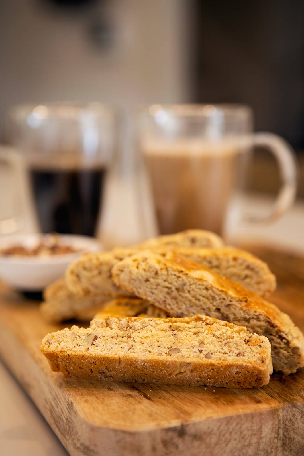 Close Up of Flour Child Butter Pecan Biscotti with Coffee in the background